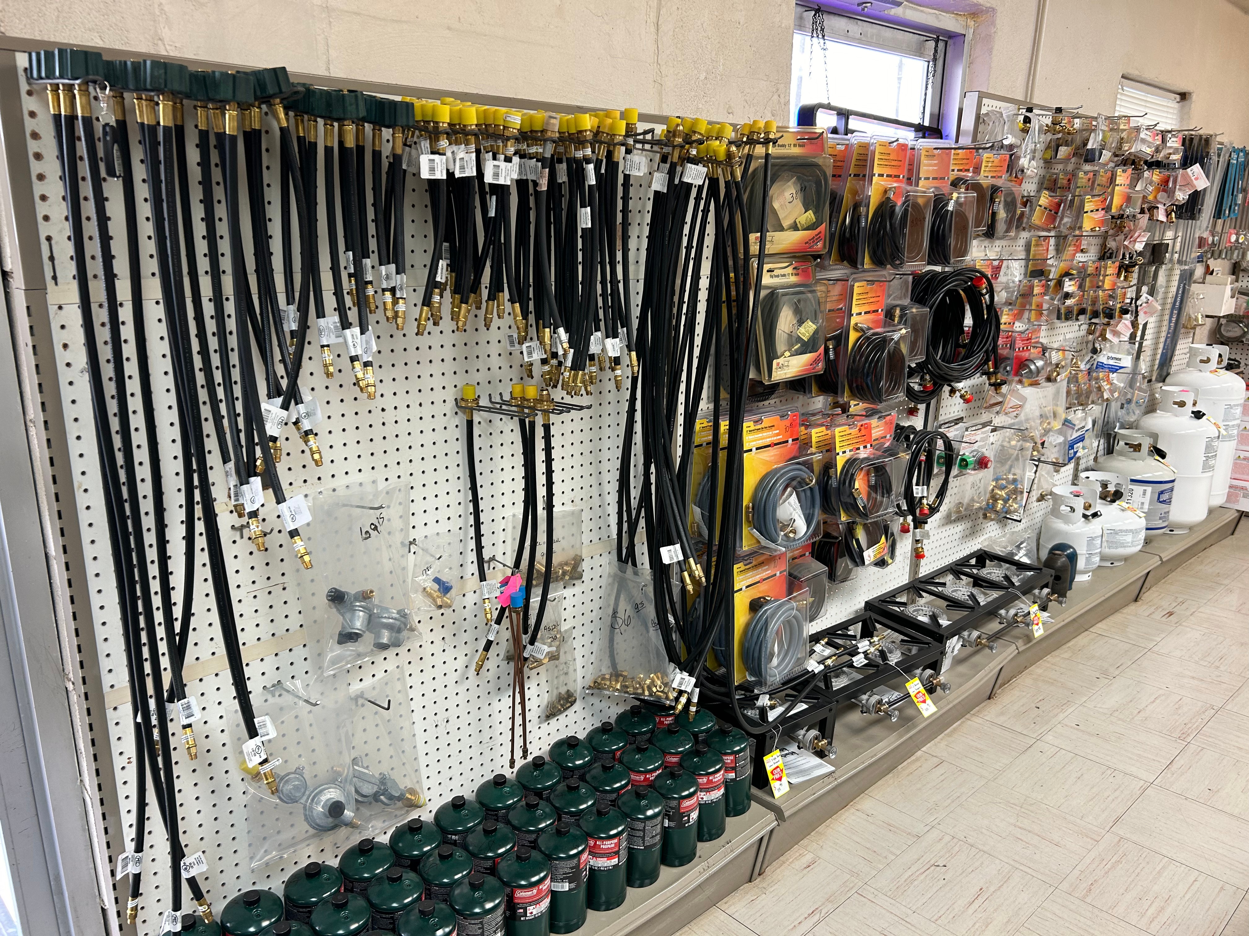 Propane hoses and fittings wall at Action Propane in Leander TX