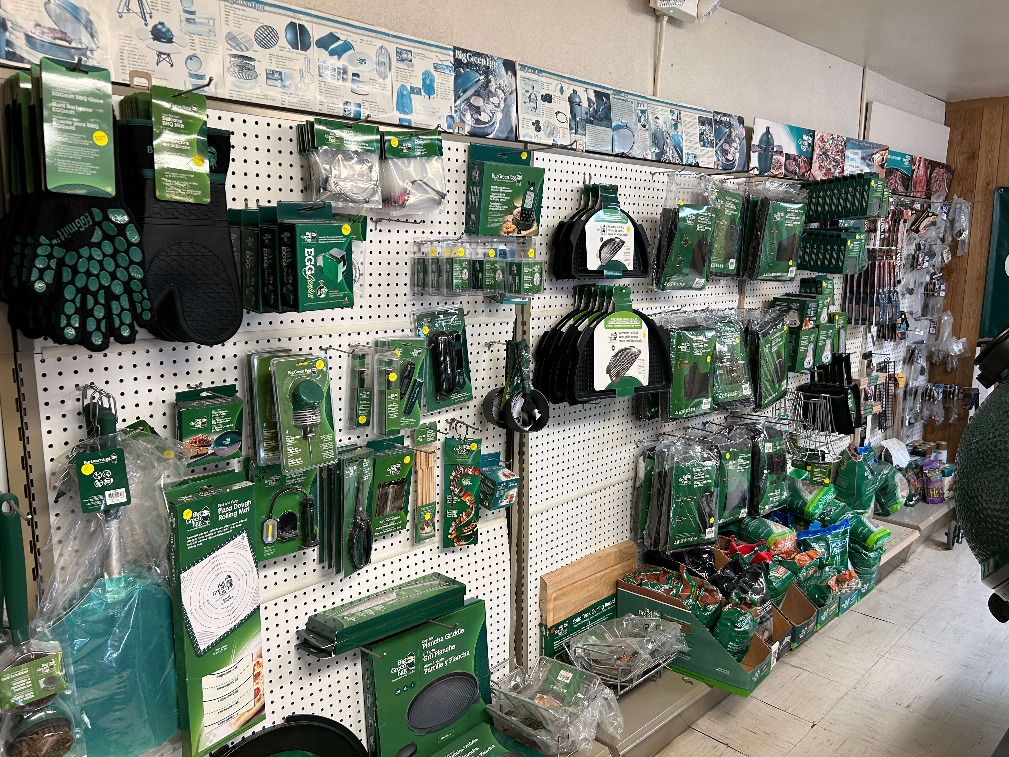 Big Green Egg accessories wall — EGGmitts, plancha griddles, and tools at Action Propane